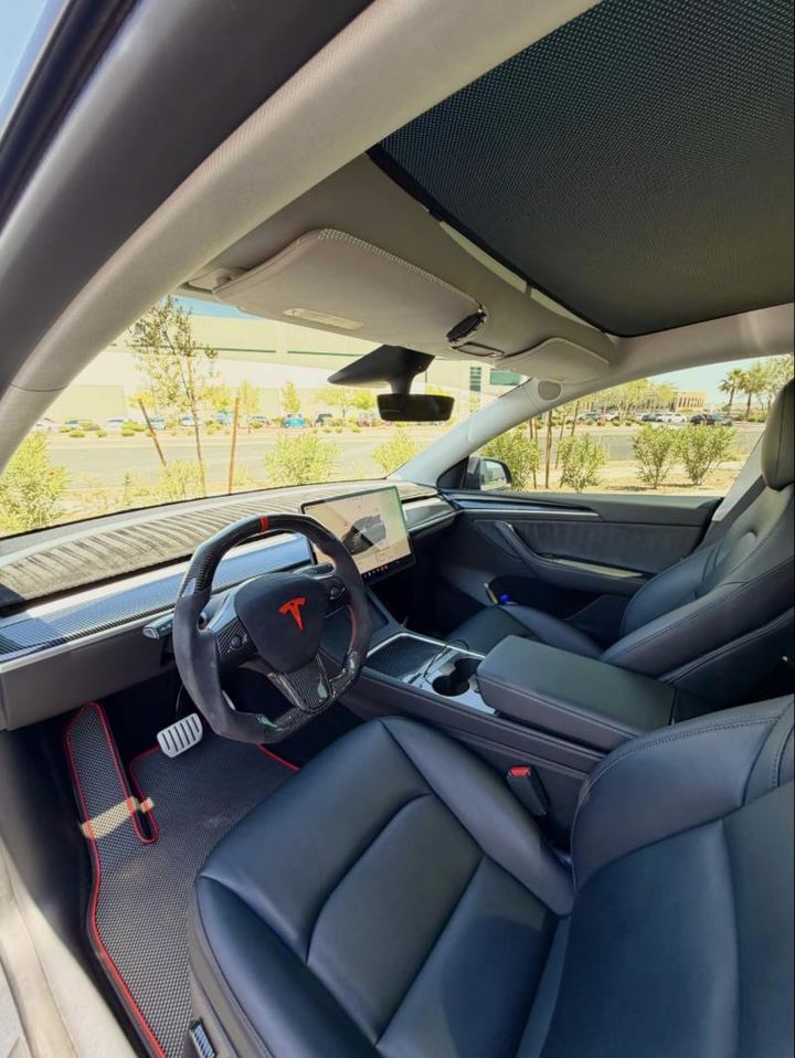 Clean black leather interior of a Tesla after a deep reset detail